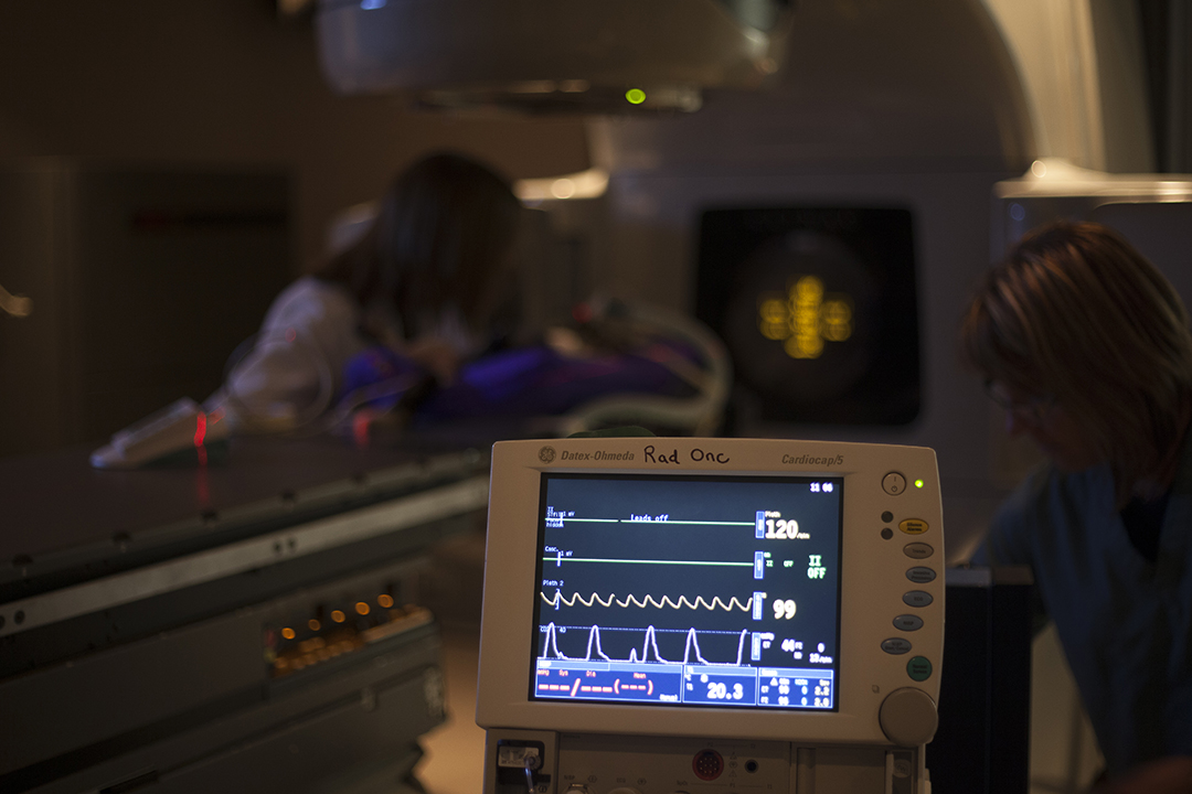 An anesthetized cat is placed in the cradle that's part of the linear accelerator at the WCVM Veterinary Medical Centre. 